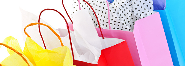Many colorful shopping bags on white background